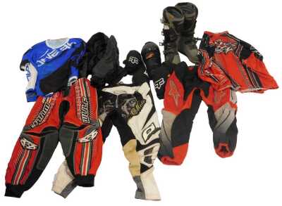 Various motocross and off road clothing, to include Wolf Sport, Alpine Star, various jerseys, and a pair of off road boots.