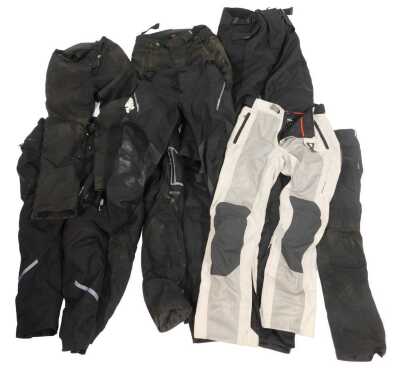 Various motorbike trousers, differing makes and sizes, to include Alpine Star, Revit, and RST.