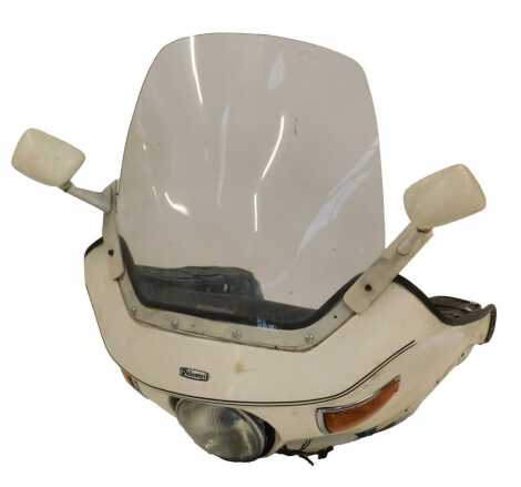 A Rickman motorcycle front fairing, in white, removed from a 1973 BMW R75/7.