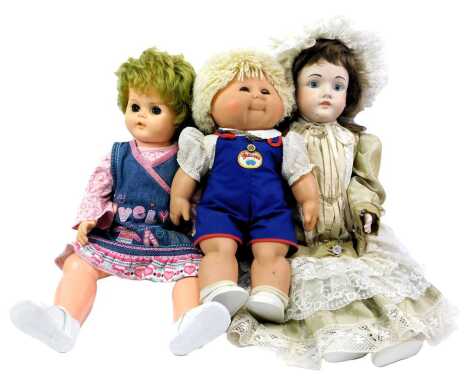 A Schoenau and Hoffmeister 1906 bisque headed doll, a Zapp Creations Cabbage Patch Doll, and another. (3)