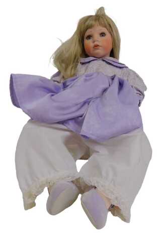 A Celia limited edition porcelain doll, in purple dress, 60cm.