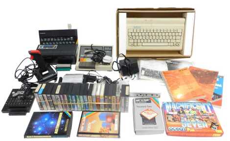 A Sinclair ZX Spectrum original keyboard, boxed, a Sinclair ZX printer, a joystick, a Sanyo data recorder, a Rotronics wafer drive, ZX Spectrums games including Ghostbusters, Sinclair ZX Spectrum capital letters, Ocean Magnificent Seven games including St