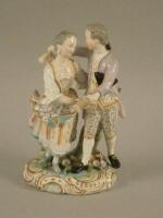 A 19thC Derby porcelain group of a gentleman and lady