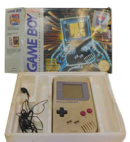 A Nintendo Game Boy compact game system, boxed, including Tetris game pack and headphones.