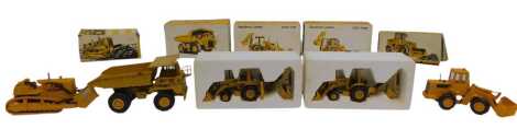 NZG Models and Conrad diecast Caterpillar implements, including CAT 769C dump truck, CAT 936 wheel type loader, CAT 428 backhoe loader, CAT 416 backhoe loader, and CAT D9 track type tractor. (5)