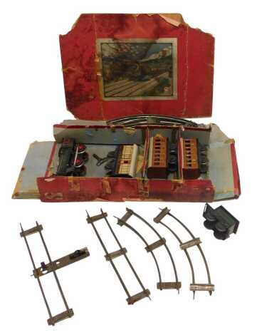 A Carl Bubb clockwork tinplate train set, including 0-4-0 locomotive, third and first class coaches, guards coach and track, with original box. (1 tray, AF)