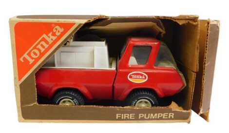 A Tonka 1256 fire pumper, boxed.