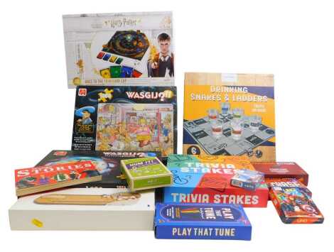 Various board games and jigsaw puzzles, including Speak Out, Bingo games, Connect 4, Exploding Kittens card game, Play That Tune, Trivia Stakes, etc. (1 box)