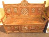 A 19thC Gothic carved oak and fruit wood settle