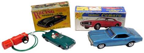 A Clifford Series racing battery operated sports car, and a Non Fall Mystery Bump N Go battery operated Chevrolet Camaro, boxed. (2)