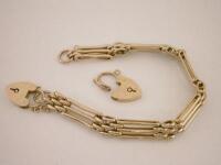 A 9ct gold three bar gate bracelet