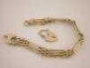 A 9ct gold three bar gate bracelet