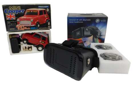 A Radiotron Mini Cooper remote control car, and a Goji VR Universal VR with detachable stereo headphones, boxed. (2)