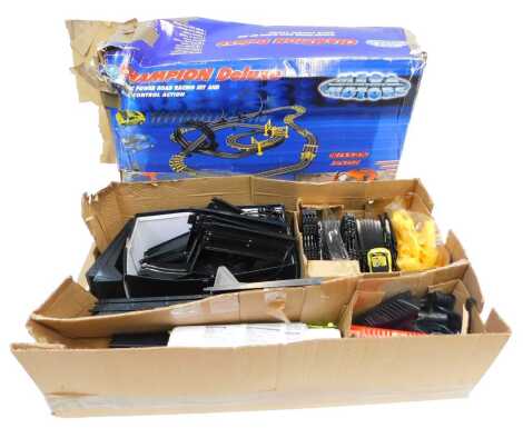 A Mega Motors slot racing Champion Deluxe electric power road racing set and controllers, boxed.