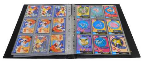 A card album of Pokemon trivia cards and other Pokemon cards, including Abra, Shinx, Mareep, Swoop Back, etc.