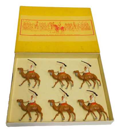 A set of six Mid West British Importers Milwaukee Wisconsin painted lead figures, depicting Arabs seated on camels, 9cm high, boxed.