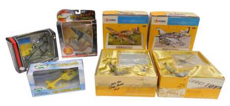 Two Corgi diecast planes, comprising a Hawker Hurricane MK1 and a P15D Mustang, each boxed, together with a Lincolnshire and Nottinghamshire Air Ambulance helicopter, a Corgi Vanbirds aircraft, and a Motor Max Skywings plane.