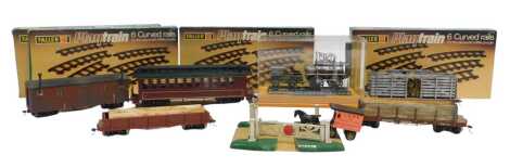 A Bachmann Locomotion 1 cast metal locomotive and tender, contained in a Perspex box, together with various Bachmann OO gauge carriages, Faller play train curved rails, various boxes, etc. (1 tray)