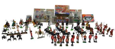 A group of moulded plastic figures, to include Queen's Guard on horseback, figure in armour, Cowboys and Indians, etc. (2 trays)