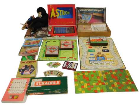 Various board games, to include Monopoly, Totopoly, Mastermind, Travelling Chess, Pelham Puppet, monkey pyjama case, etc. (2 boxes)