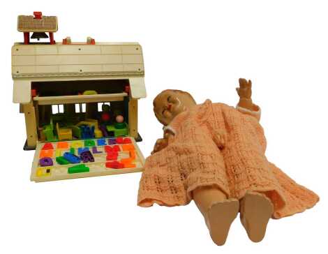 A Fisher Price school and accessories, and a cellulose headed doll. (2)