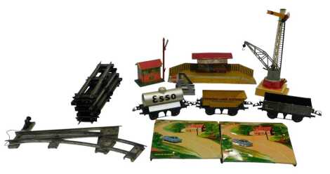 Hornby Trains and other O gauge and OO gauge rolling stock and accessories, including a No.1 rotary tipping wagon, Hornby Trains B1 one dozen straight rails, Hornby Trains platform crane, Hornby Trains Semaphore No.2 signal, Hornby Trains No.1 buffer stop