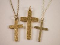 Various yellow metal crucifixes and chains