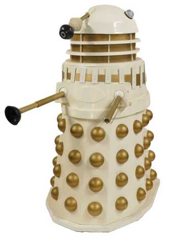 An Imperial Dalek, circa 1980s, in cream, with gold painted buttons, stalk and weapons, on a decagonal base, 162cm high.