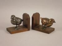 A pair of similar French Art Deco style book ends