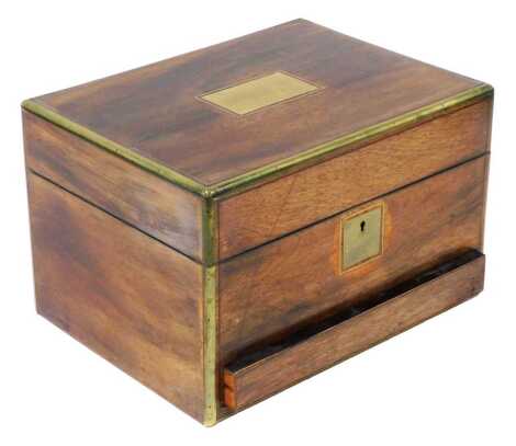 A Victorian rosewood and brass bound work and jewellery box, with brass escutcheon and engraved name plate, the hinged lid opening to reveal a partially fitted interior, above a fitted frieze drawer, 19cm high, 30.5cm wide, 23cm deep.