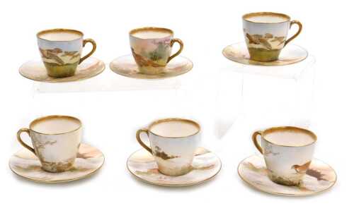 Six Royal Doulton porcelain cups and saucers, three depicting grouse and numbered BB3530 H4586, bearing signature M Betteley, and three further examples with pheasants and grouse in snowy landscapes, numbered BB3530 H4586, with same artist's signature. (6