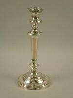 A silver plated candlestick of tapering form