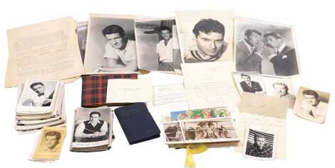 A group of autographed photo cards, and photographs, including Dean Martin & Jerry Lewis, Hugh O'Brian, and McDonald Carey, together with greetings cards and photo cards, an International Film Diary 1953, and an autograph album.