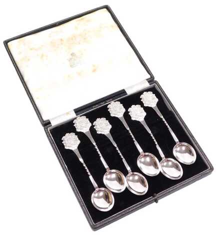 A set of six George V silver coffee spoons, with Royal Coat of Arms terminals, above a banner initialled N.B.B.R.C., cased, Birmingham 1911, 2.57oz.