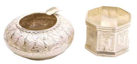 A Victorian silver napkin ring, with engraved decoration, shield reserves, one monogram engraved, London 1891, 1.17oz, together with a Malay silver ashtray, with engraved leaf decoration, 0.76oz. (2)