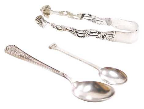 A pair of George V silver sugar tongs, with pierced foliate decoration, Sheffield 1916, together with an Elizabeth II silver teaspoon, Sheffield 1958, and an Indian colonial silver seal top coffee spoon, 2.12oz.