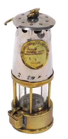 A Protector Lamp & Lighting Company Limited brass and white metal miner's lamp, type 6, No.9, 24cm high.