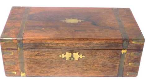 A Victorian rosewood and brass bound box, with brass escutcheons, the hinged lid opening to reveal a three section baize lined interior, with key, 50.5cm wide.