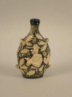 A 19thC stoneware relief moulded flask