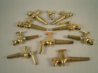 Ten various polished brass barrel taps.