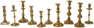 Five pairs of Georgian and later brass candlesticks, largest pair 23.5cm high.