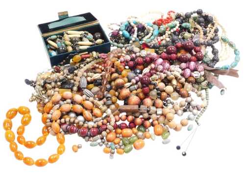 A group of costume jewellery, necklaces, hardstones, faux amber, wooden and crystal. (a quantity)