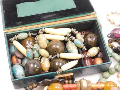 A group of costume jewellery, necklaces, hardstones, faux amber, wooden and crystal. (a quantity) - 2