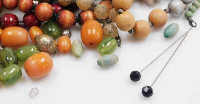 A group of costume jewellery, necklaces, hardstones, faux amber, wooden and crystal. (a quantity) - 3