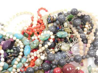 A group of costume jewellery, necklaces, hardstones, faux amber, wooden and crystal. (a quantity) - 4