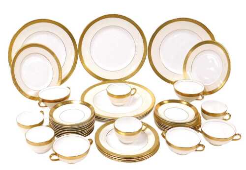 A Minton porcelain Buckingham pattern part dinner and tea service, comprising six dinner, dessert and side plates, five soup cups, five teacups and twelve saucers.