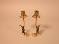 A pair of Art Nouveau style bronzed copper candlesticks in the manner of Benson