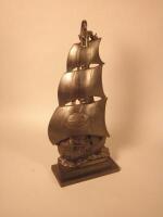 A steel fireside companion made by Nestor in the form of a galleon