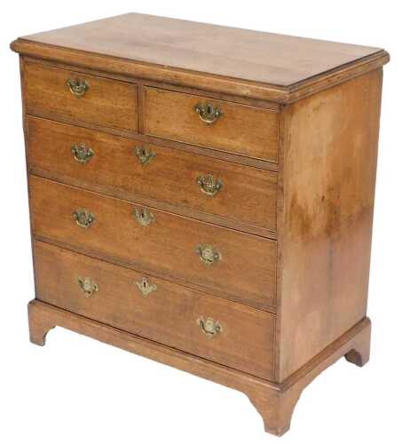 A George III oak chest, of two short over three long graduated drawers, raised on bracket feet, 98cm x 95cm x 52cm.