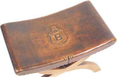 An early 20thC Heraldic x frame stool, with a curved seat, carved with a shield, with the capital letter B, 51cm wide. - 2